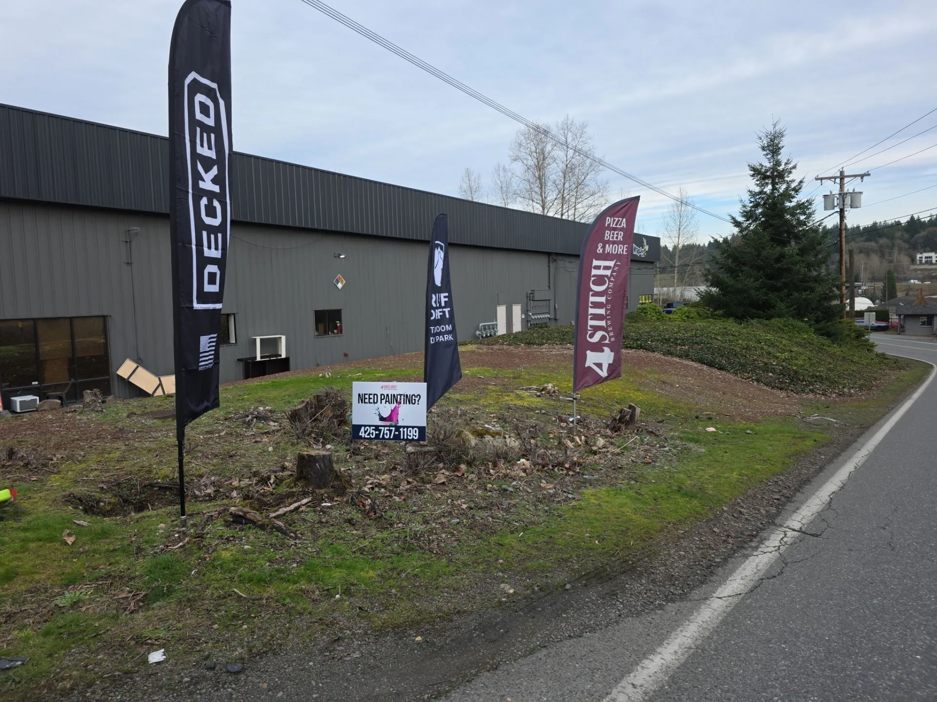 Commercial building exterior with Arclight Painting signage