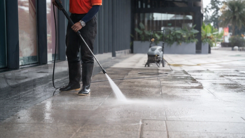 Professional pressure washing a commercial sidewalk in Bothell WA